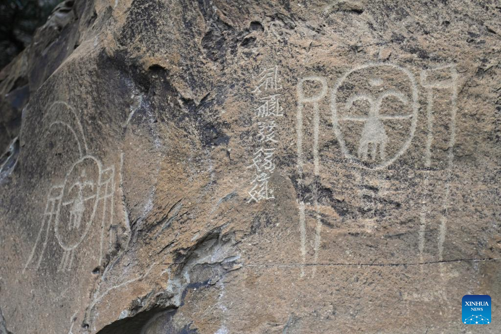 Tourists visit Helan Mountain rock painting scenic spot in China's Ningxia